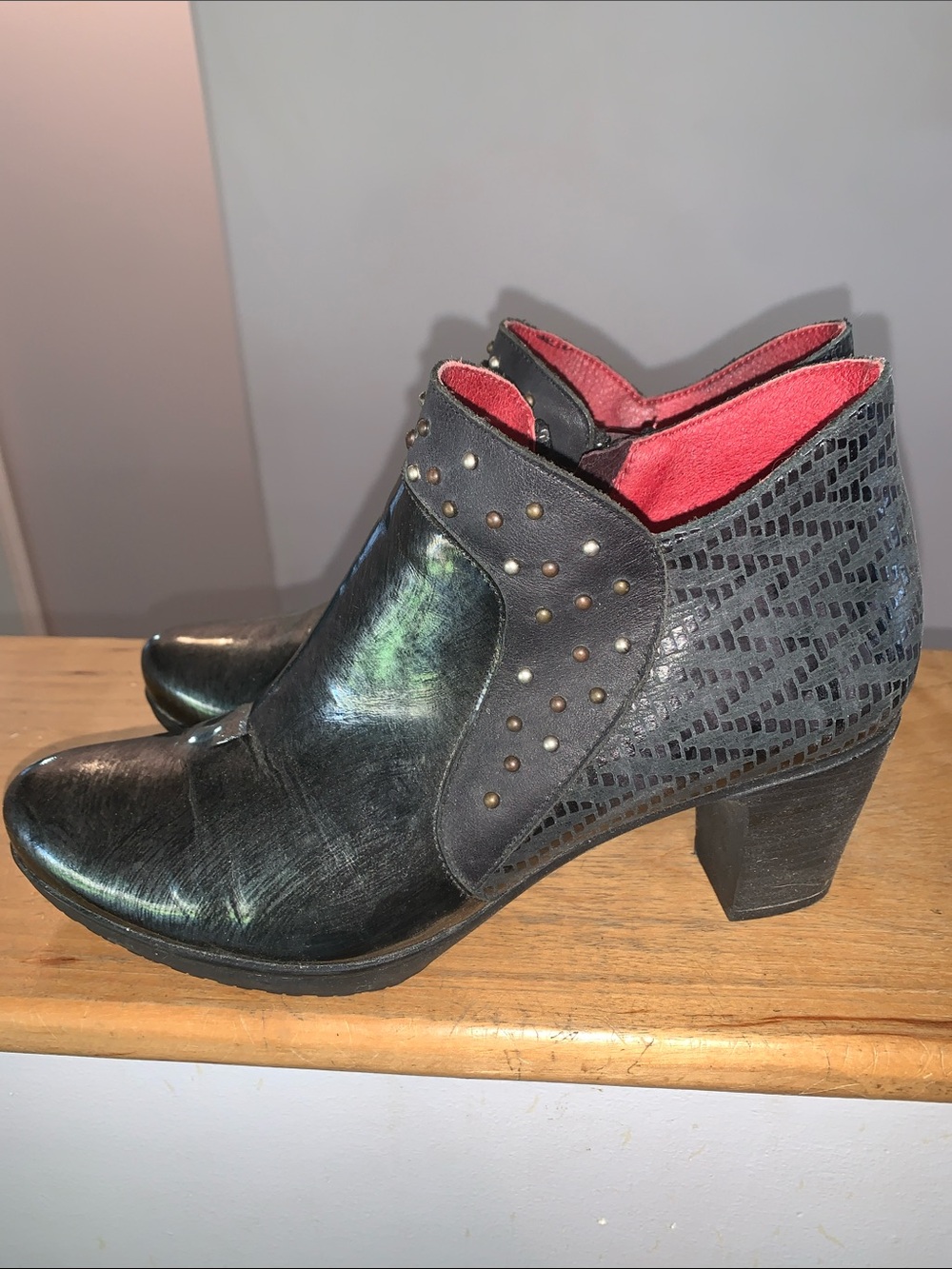 Jose Saenz Women's Metallic Black Ankle Booties with Red Lining and Stud Details